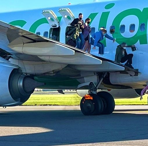 Transavia  Boeing  B737-800  aircraft  experienced  a  fire  in  the  main  gear  wheel  while  taxiing  after  landing  , did emergency Evacuation  !